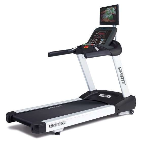 SPIRIT treadmill with digital console, mounted display screen showing a forest path, and sturdy base.