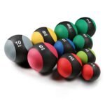 Medicine balls in various colors, labeled with weights from 1kg to 10kg