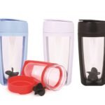 Plastic tumblers with lids in different colors, one disassembled showing a mixing blade